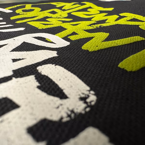 screen print on canvas tote with regular plastisol ink and puff ink