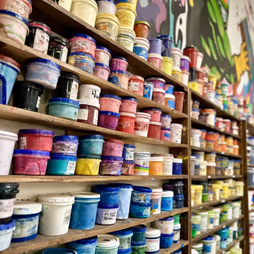 Containers of ink on shelves