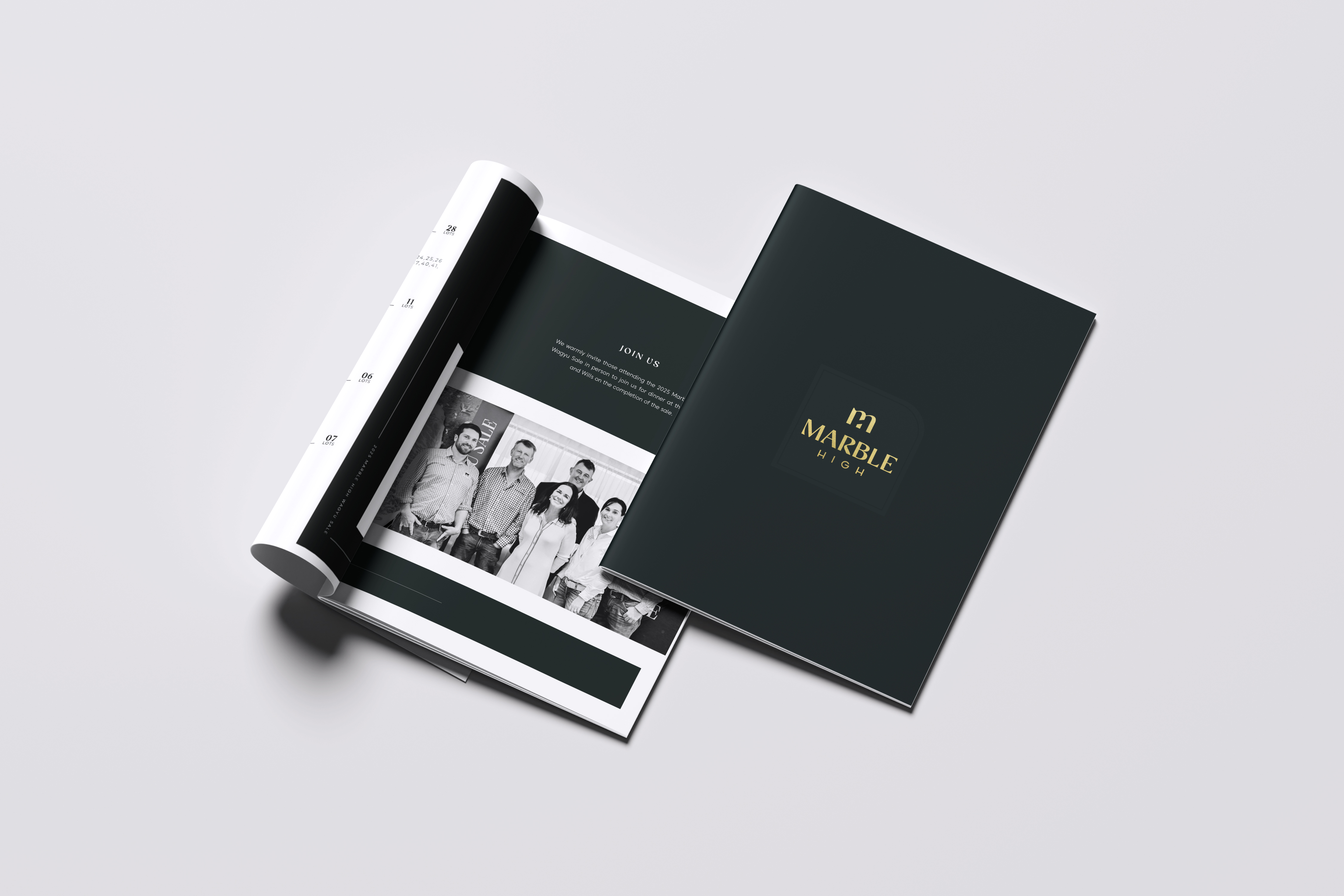 Open and closed Marble High brochure with a black cover and gold logo on a light background.