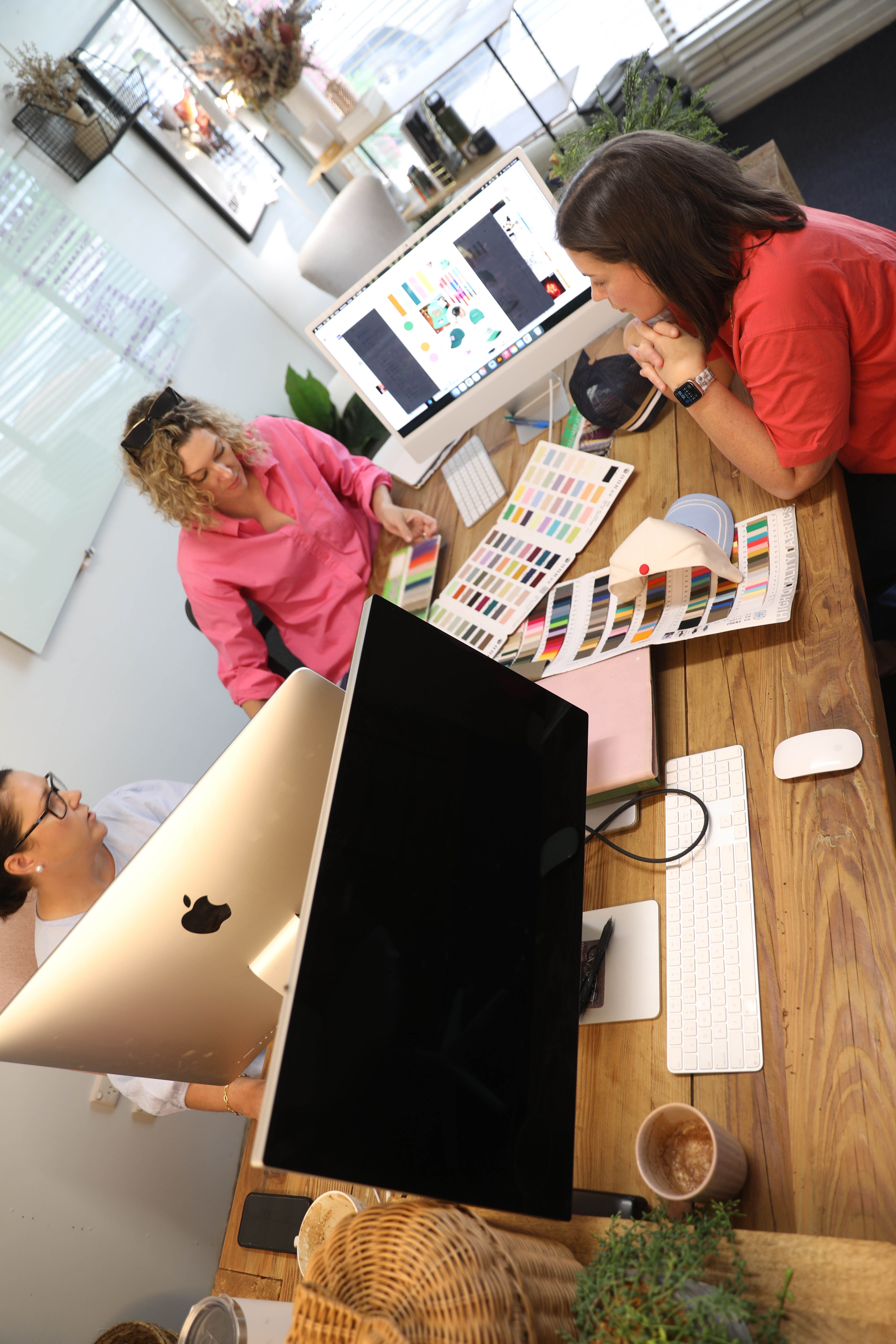 Studio team reviewing colour and design work