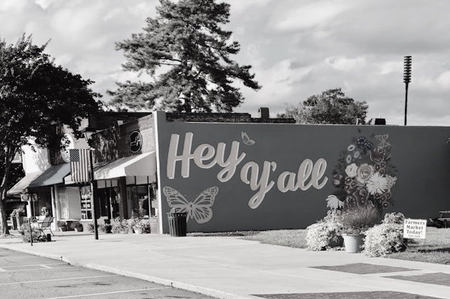 a mural on the side of a building that says "hey yall". Photo credit: Wally Holden