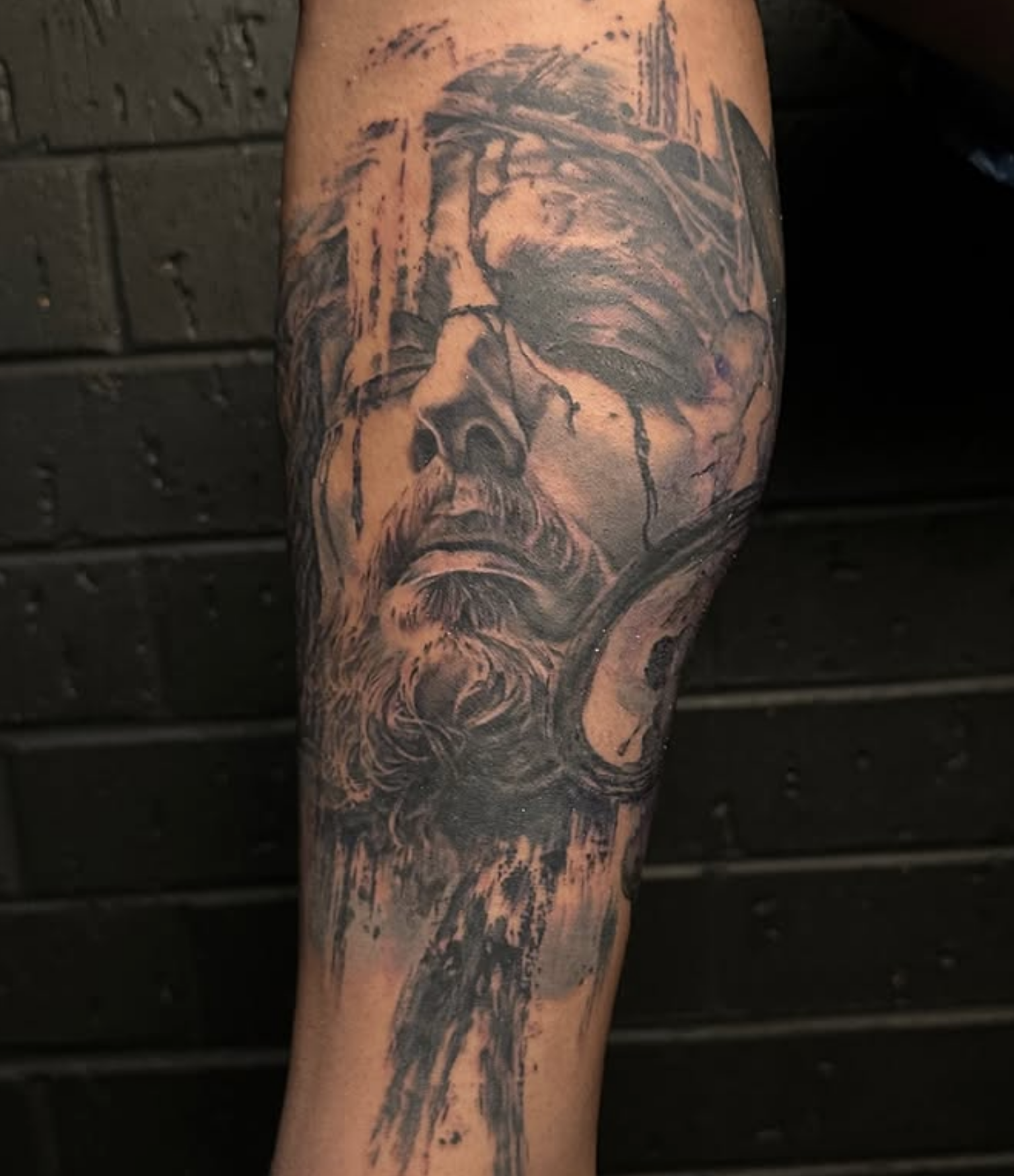 Tattoo of a portrait of Jesus with a crown of thorns by Noah Brewer