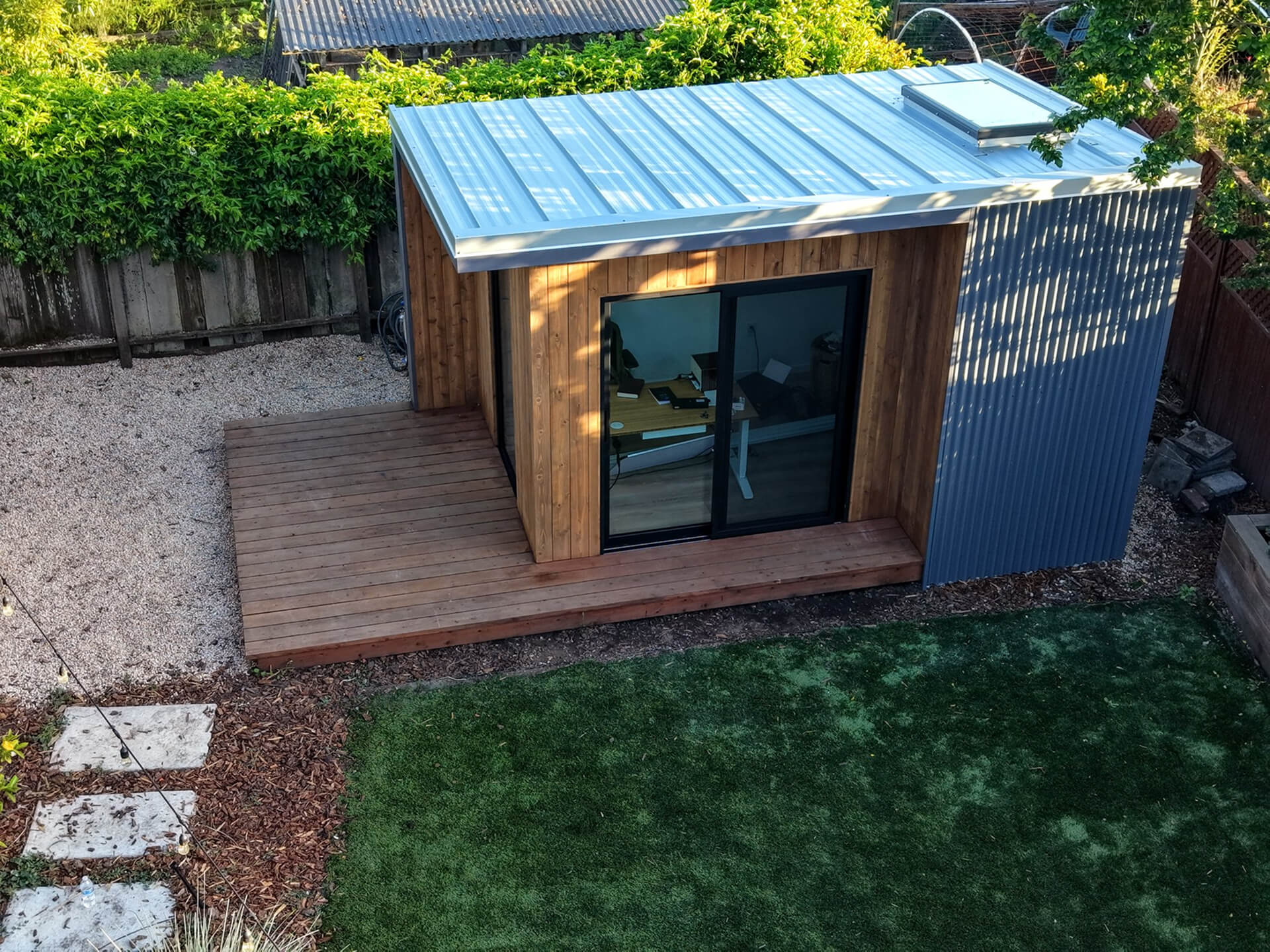 Angled front view of the Monterey backyard studio with sliding glass doors