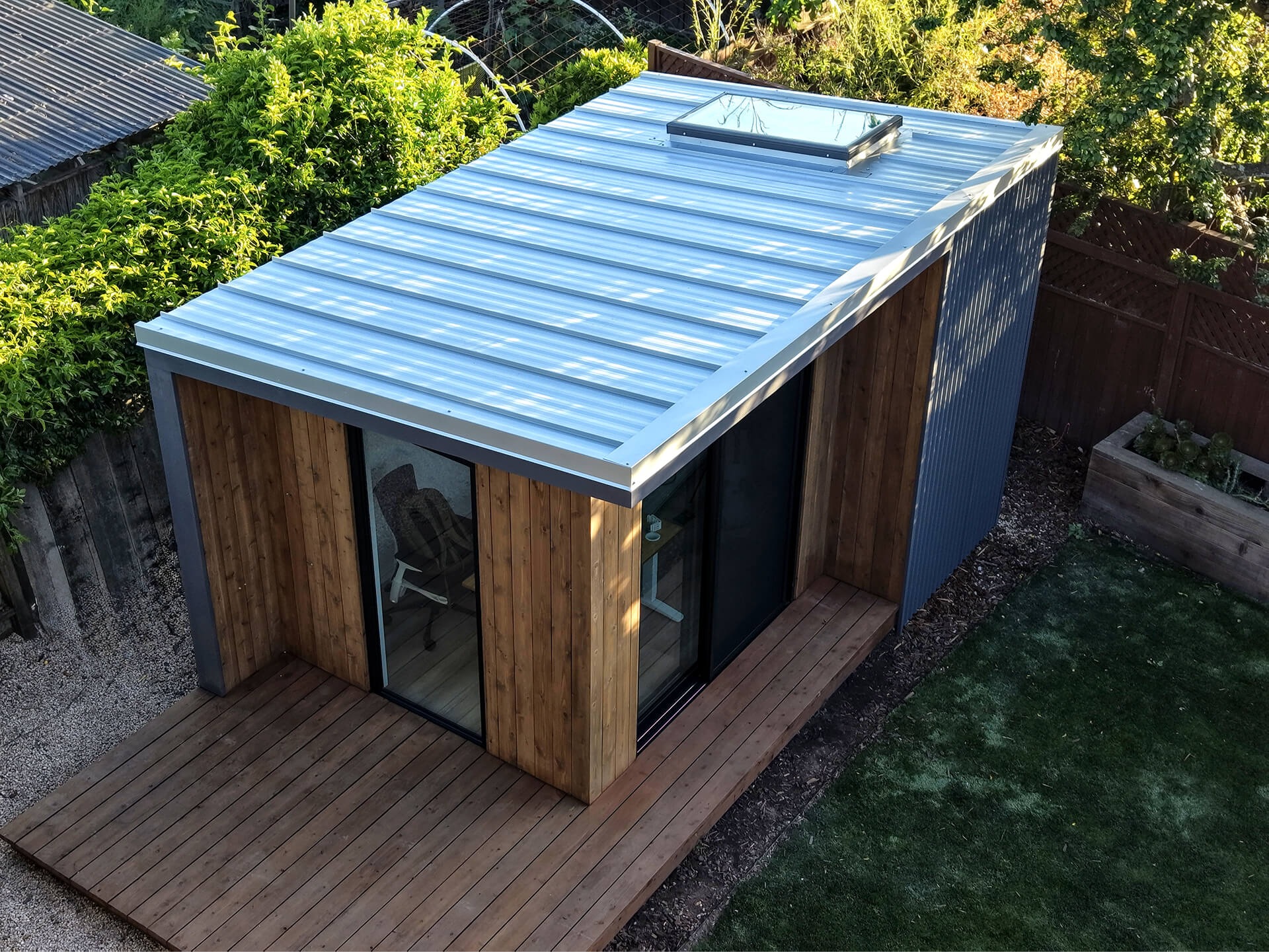 Aerial view of the Monterey custom backyard shed with spacious wood deck