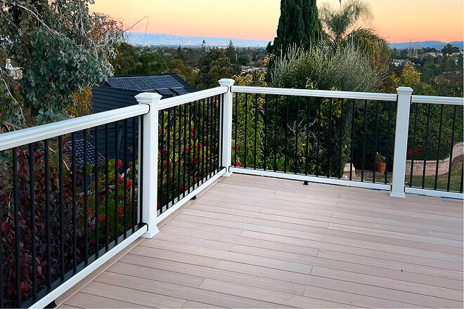 Custom elevated composite deck with black aluminum railing in the Bay Area