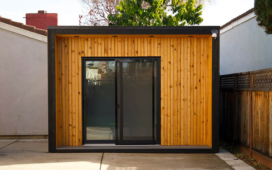 Modern Redding shed with natural wood exterior and double glass doors