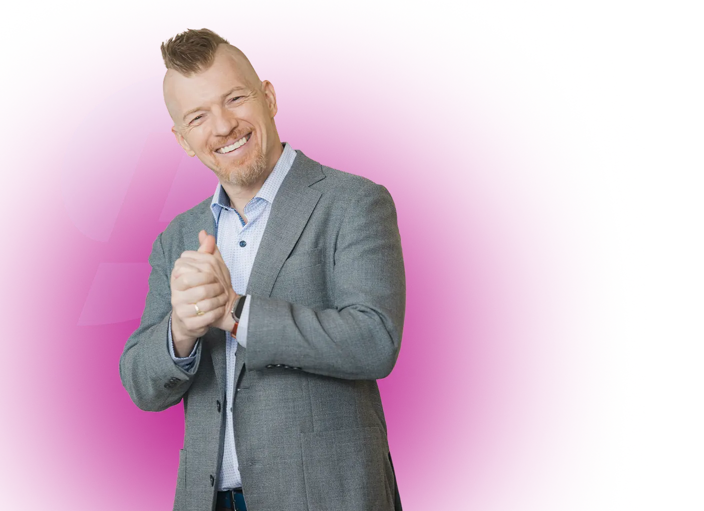 Man with a mohawk hairstyle wearing a white and black raglan shirt that reads 'BIG GAY HEART COMPASSION IS STRENGTH' on a magenta background.