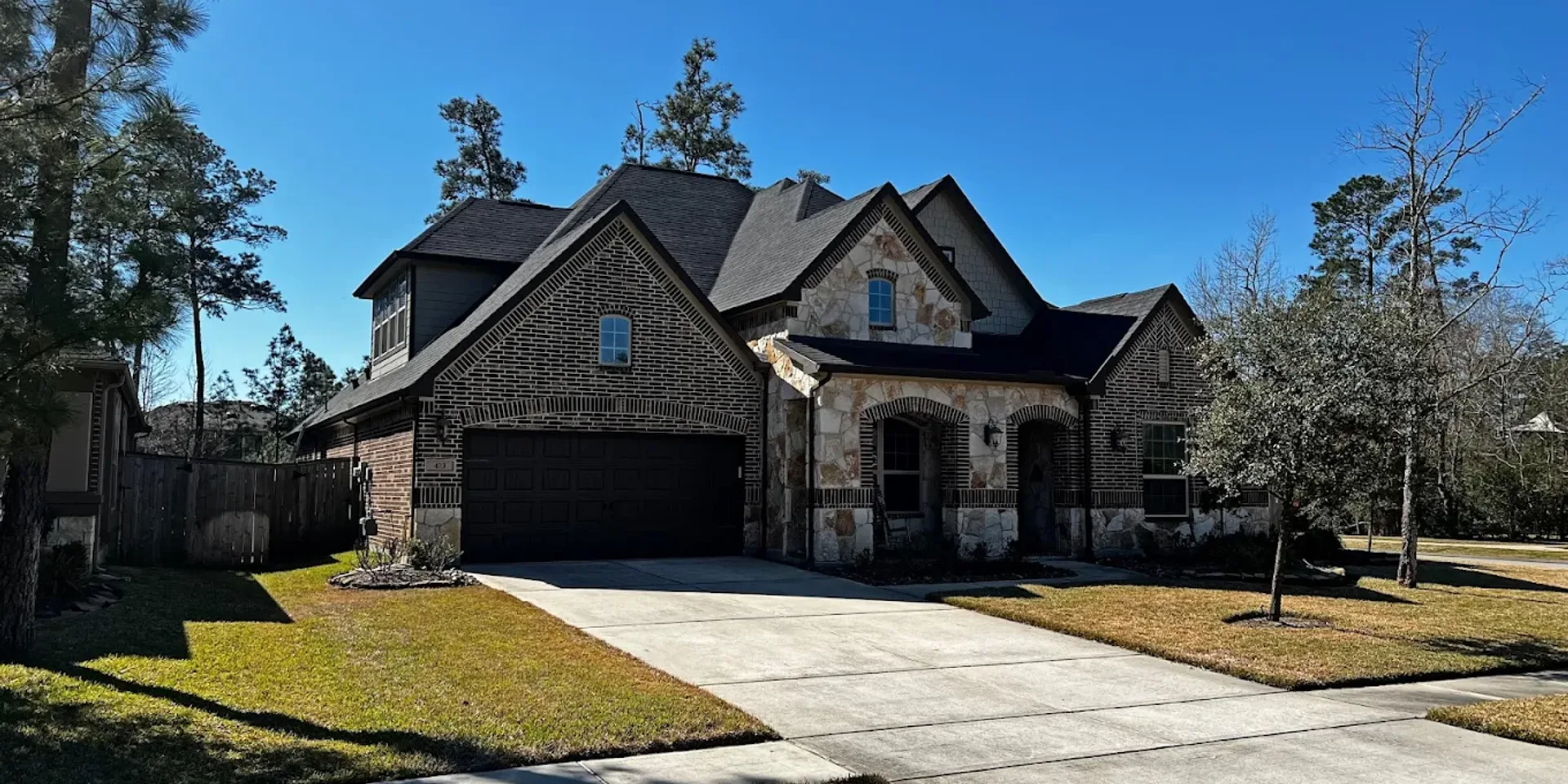 Residential roof with solar panels under a clear winter sky
