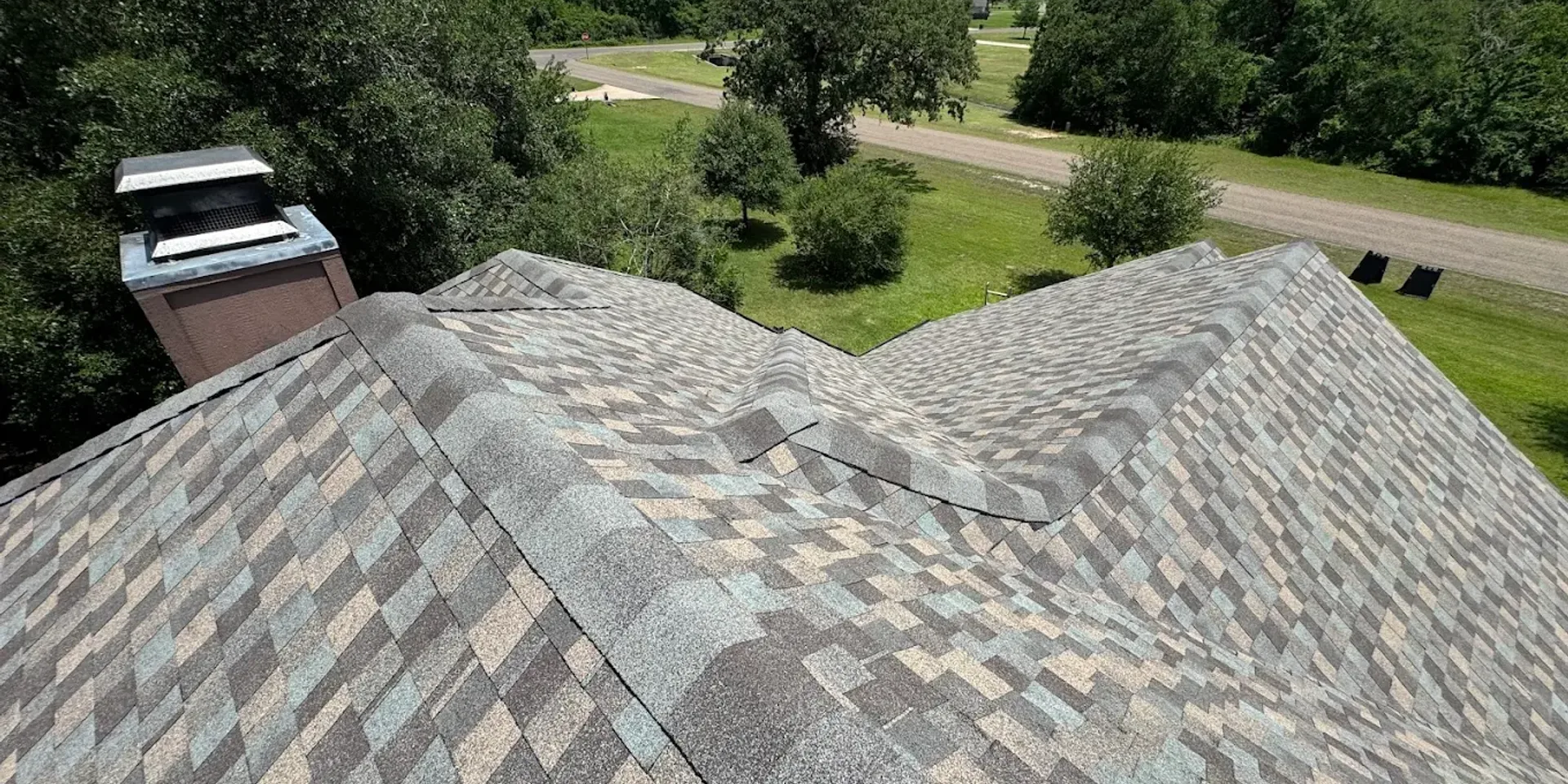 Residential roof in Houston being assessed during a home purchase