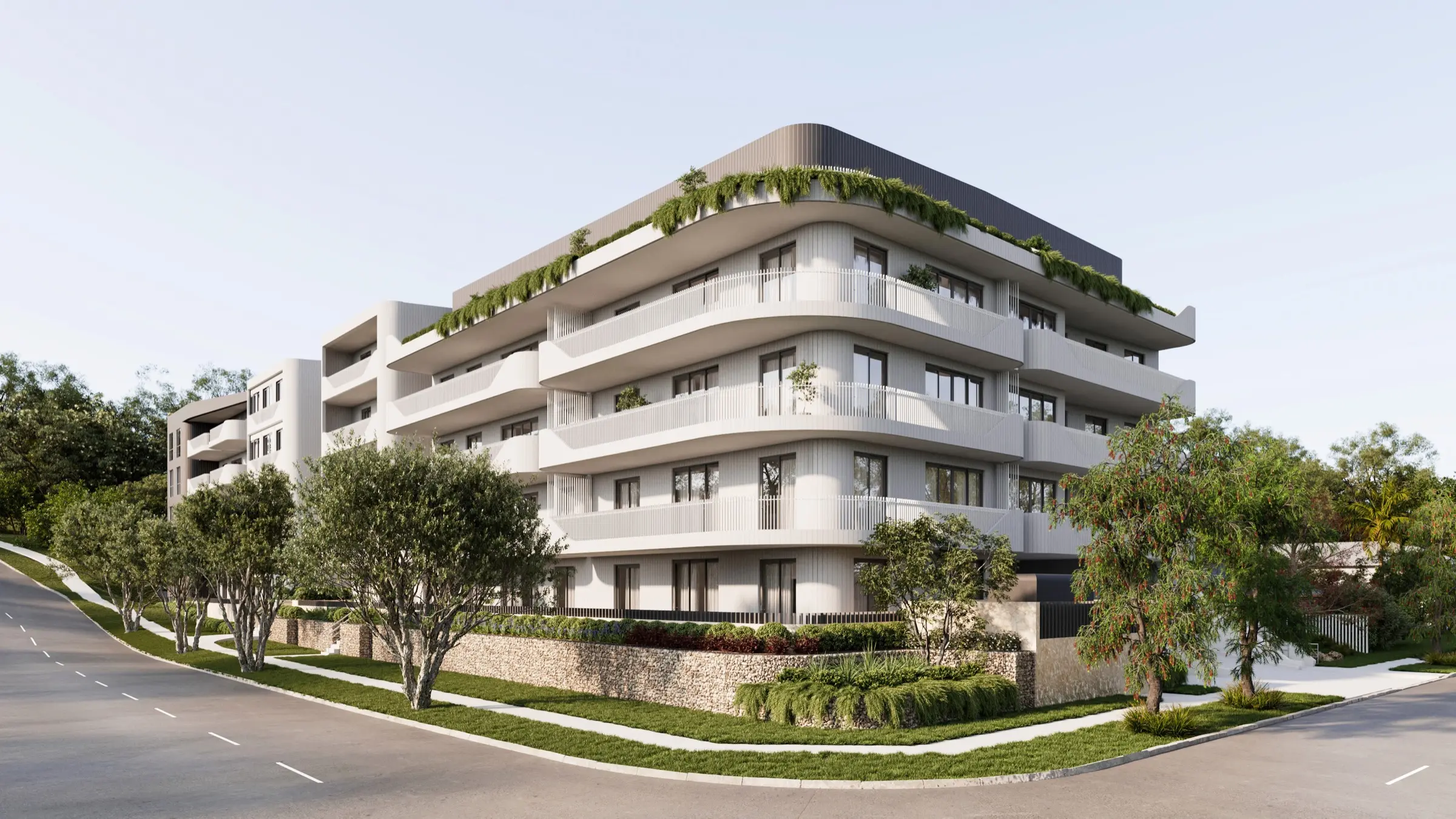 Modern four-story residential building with curved balconies, greenery, and trees along surrounding sidewalks.