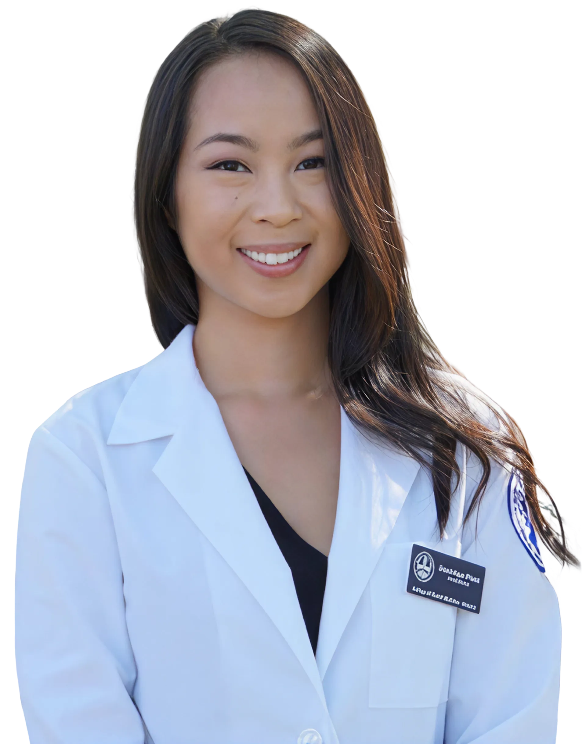 Smiling woman with long dark hair wearing a white lab coat and light blue top.