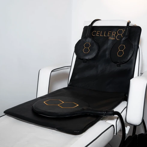 CELLER8 Max PEMF mat and loop applicators on a treatment chair.