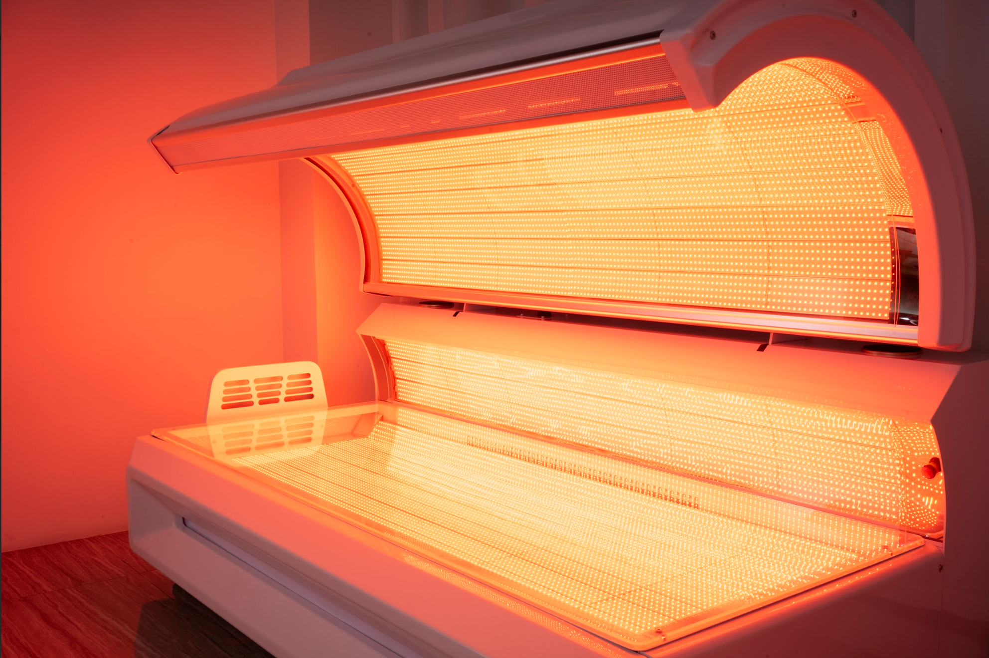 Synergy red light therapy bed with the canopy open, showing the LED interior.
