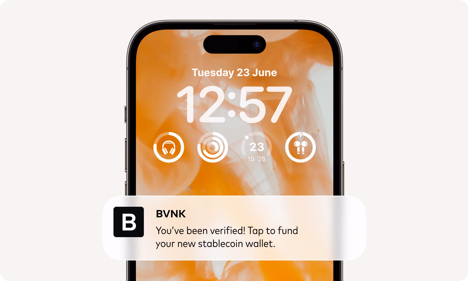 Phone lock screen notification from BVNK: verified, tap to fund your new stablecoin wallet.