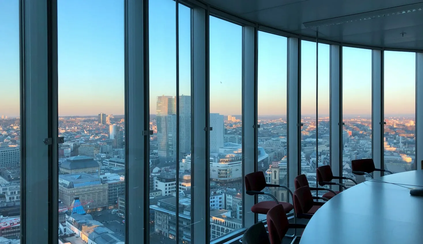 a conference room with a view of the city