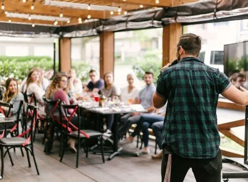 a man standing in front of a group of people
