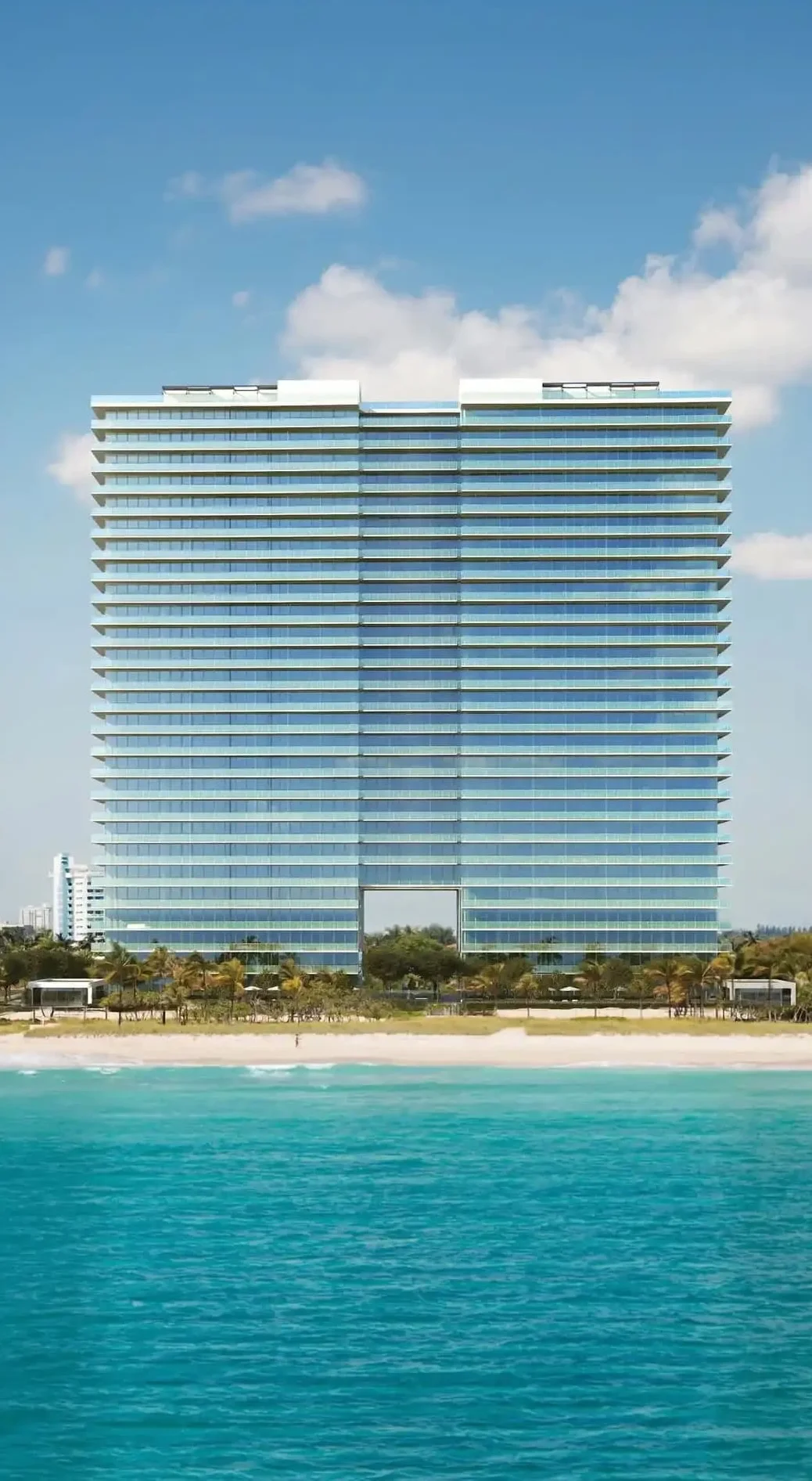 a green armchair against a dark wall