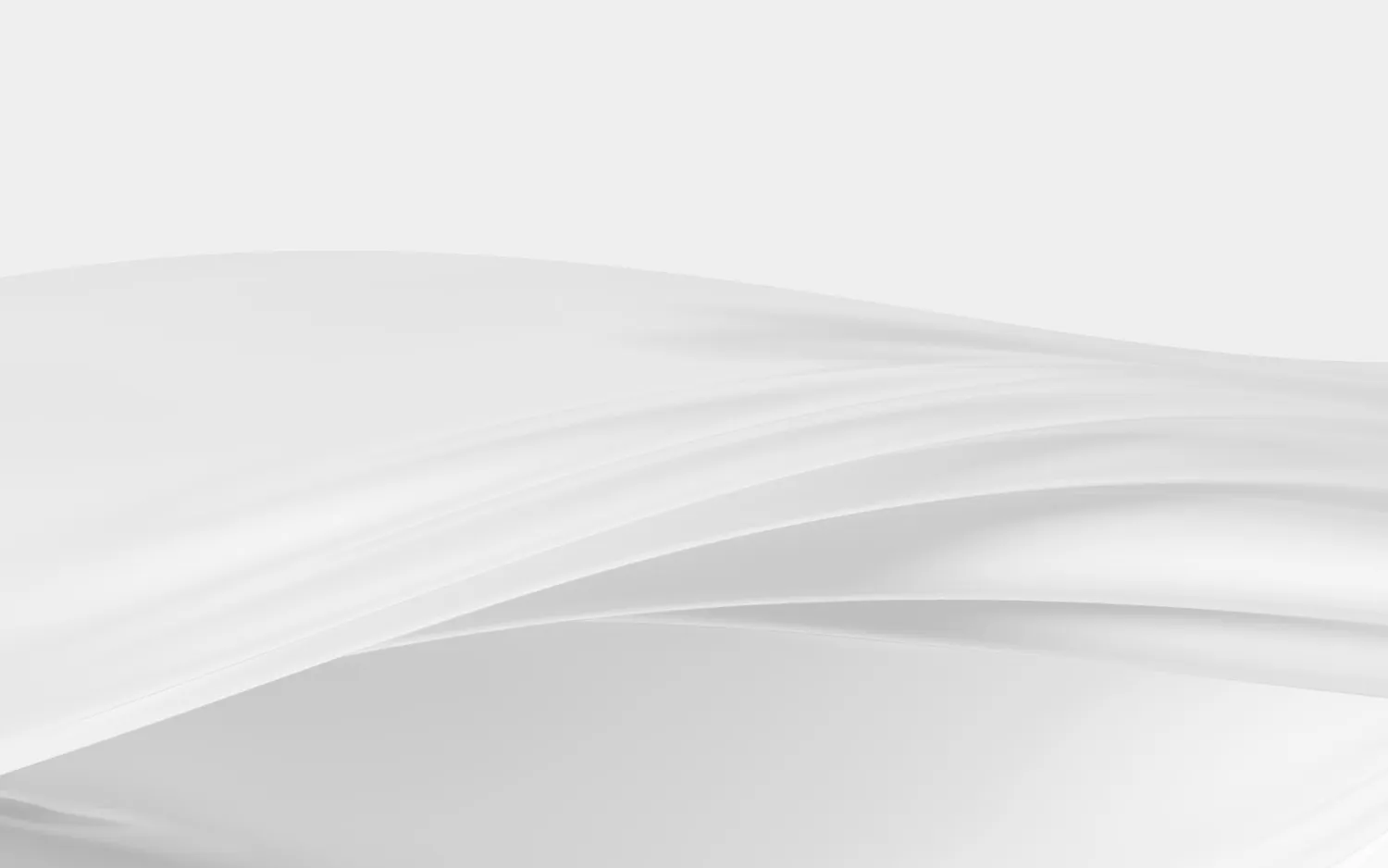 Smooth flowing translucent white fabric or wave with soft shadows on a light gray background.