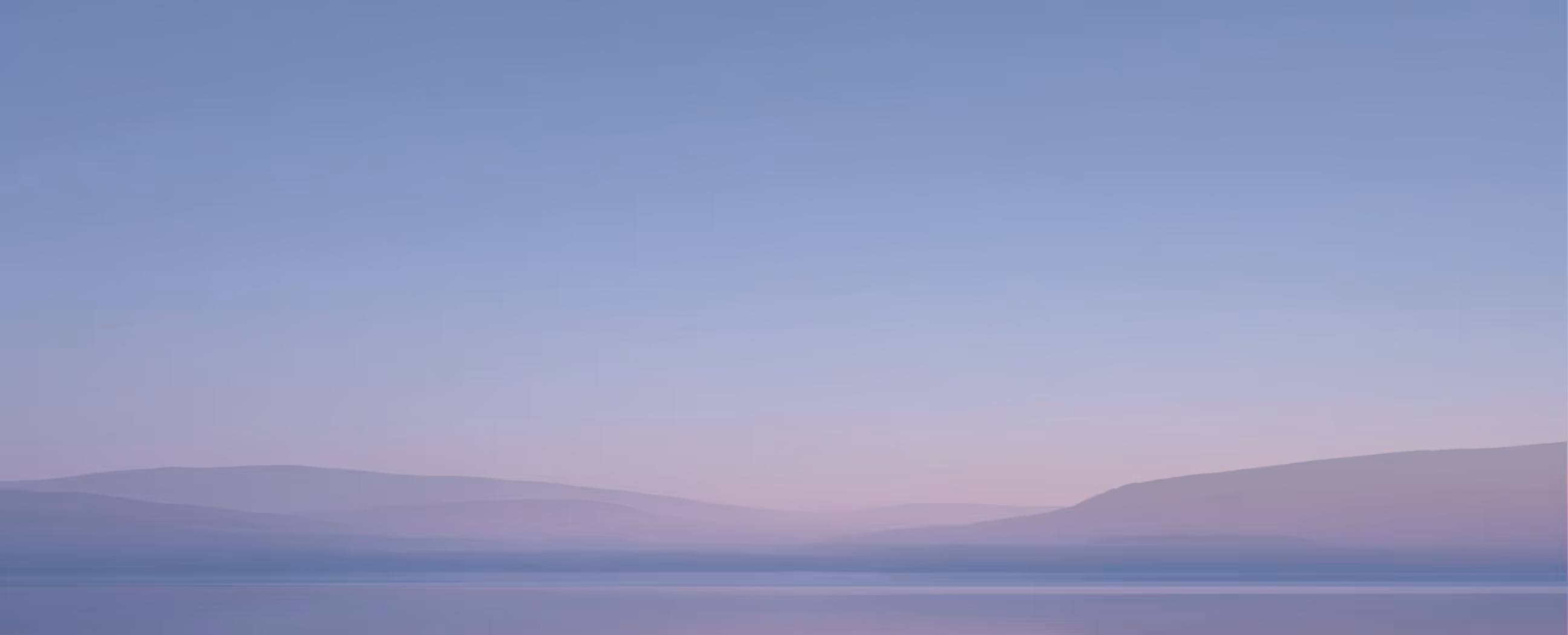 A beautiful Finnish sunset over a body of water.