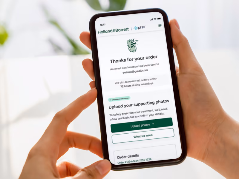 Smartphone showing order confirmation page from Holland & Barrett weight loss service app, asking to upload photos to confirm details.