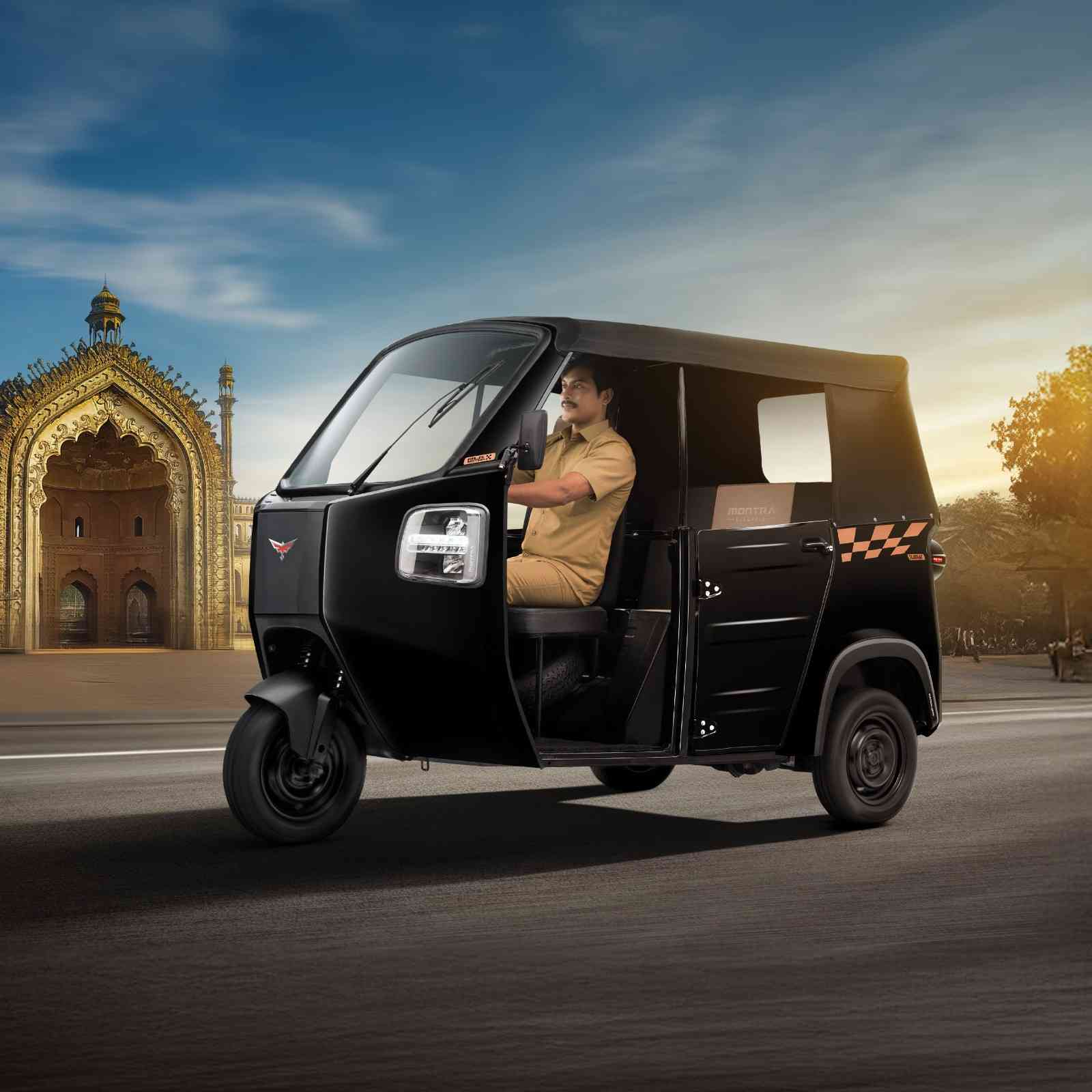 Charging electric auto rickshaw in depot