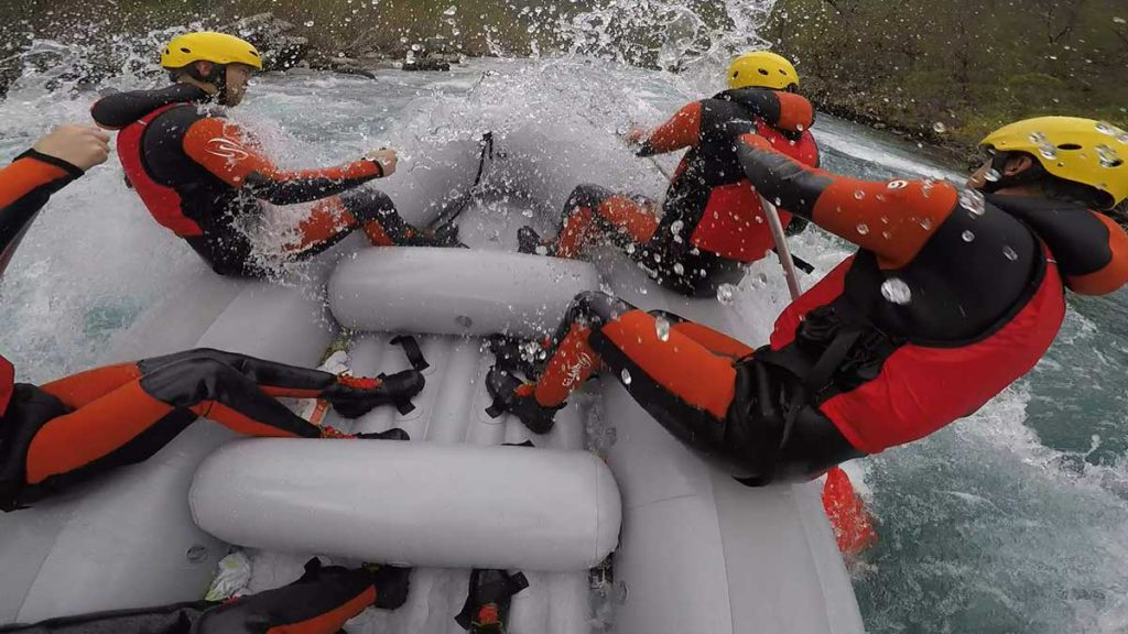 Adrenaline group rafting through Tara River canyon rapids, extreme adventure tour Bosnia