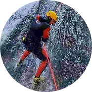 Lead guide going down with rope, canyoning Hrcavka