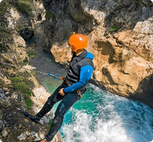 ICOpro certified local guide leading canyoning group through Hrčavka canyon, Sutjeska National Park