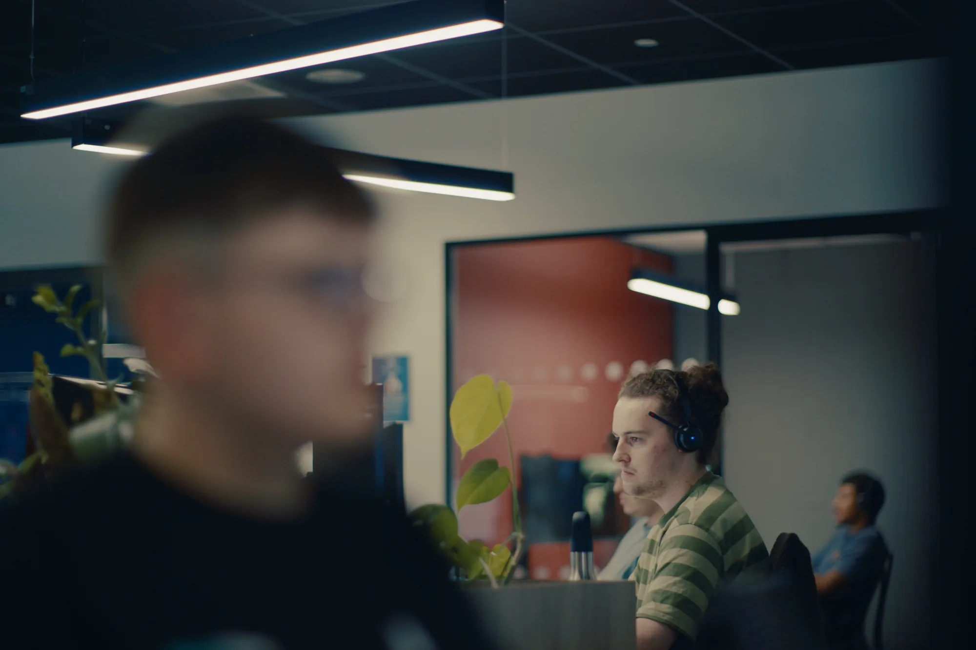 A Halo support technician wearing a headset while working through a customer issue