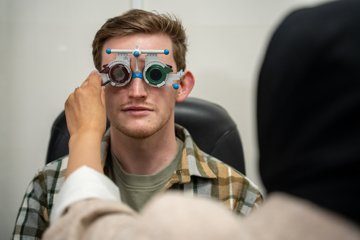 Man trying on sunglasses at Makerfield Eye Centre