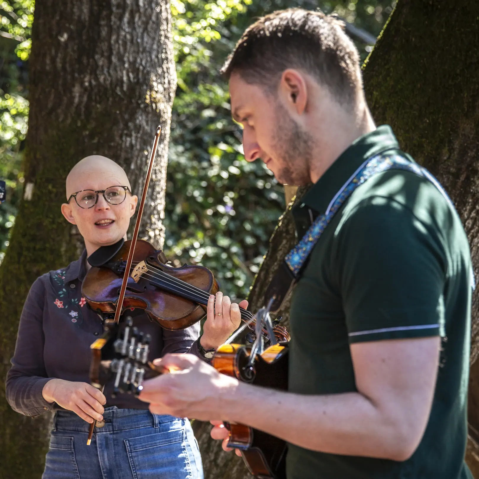 Leah and John from Critical Grass playing fiddle and mandolin