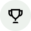 Black trophy icon inside a light gray circle.