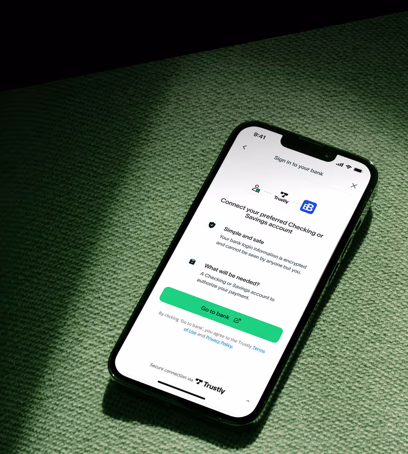 Smartphone screen displaying a bank login page with instructions to connect a checking or savings account via Trustly, highlighting security and payment authorization.