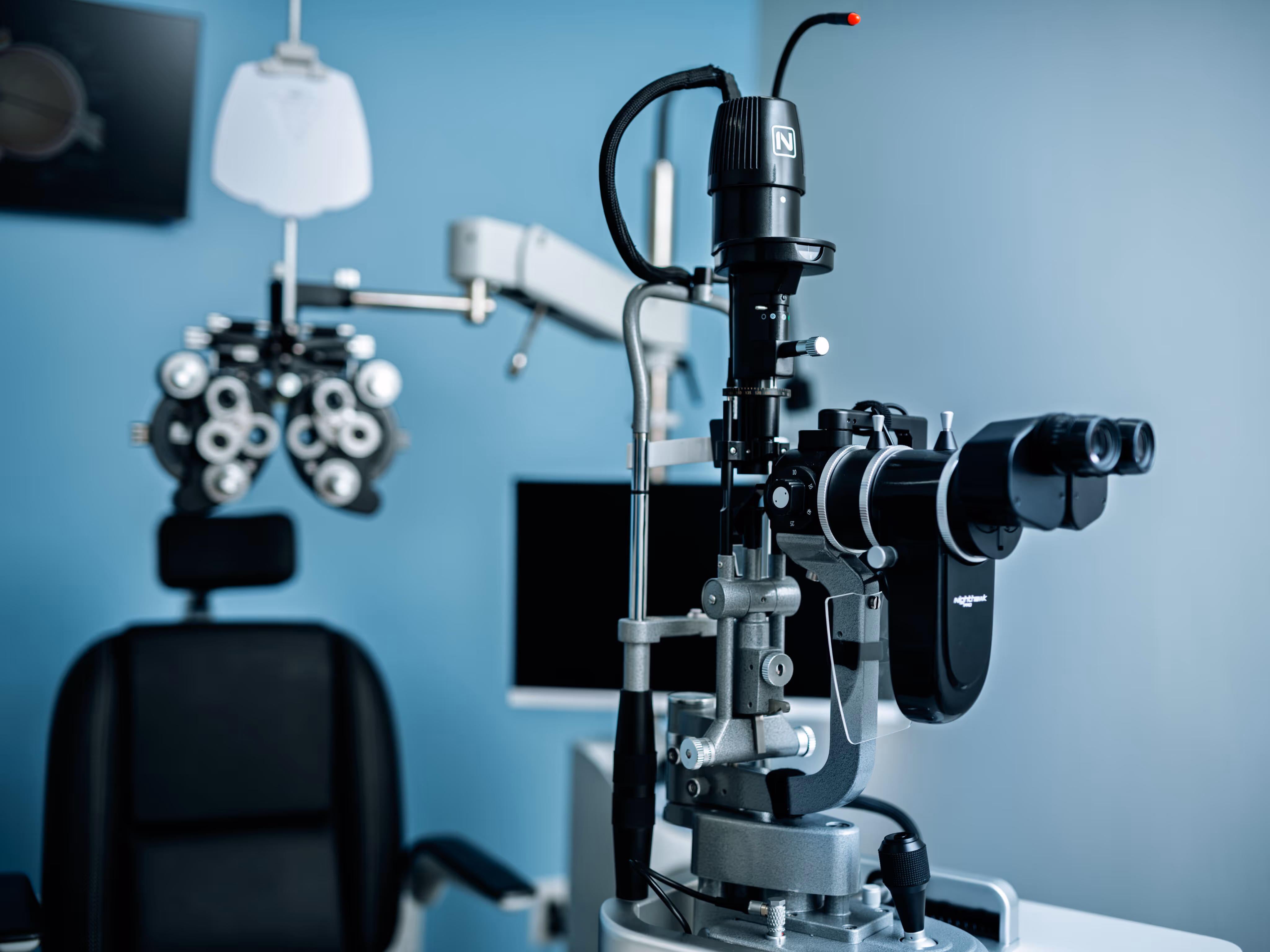 Close-up of a slit lamp biomicroscope used for eye examinations in an ophthalmology clinic.
