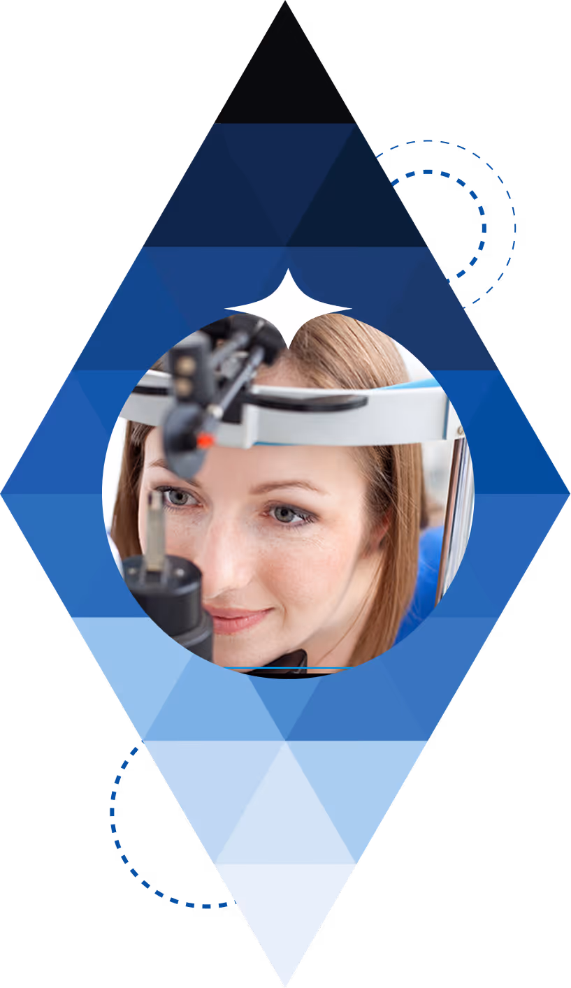 Woman undergoing an eye examination using a slit lamp device.