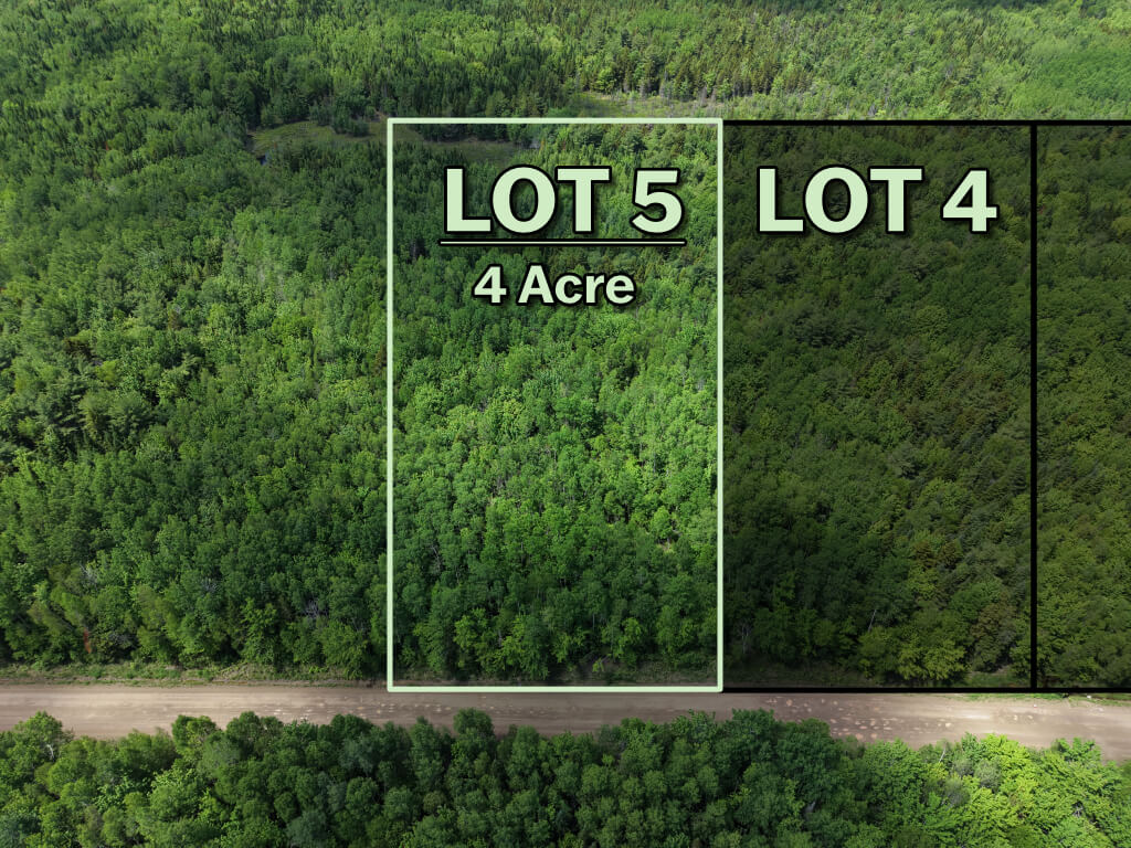 Front view of vacant land lot in Saint-Ignace, New Brunswick