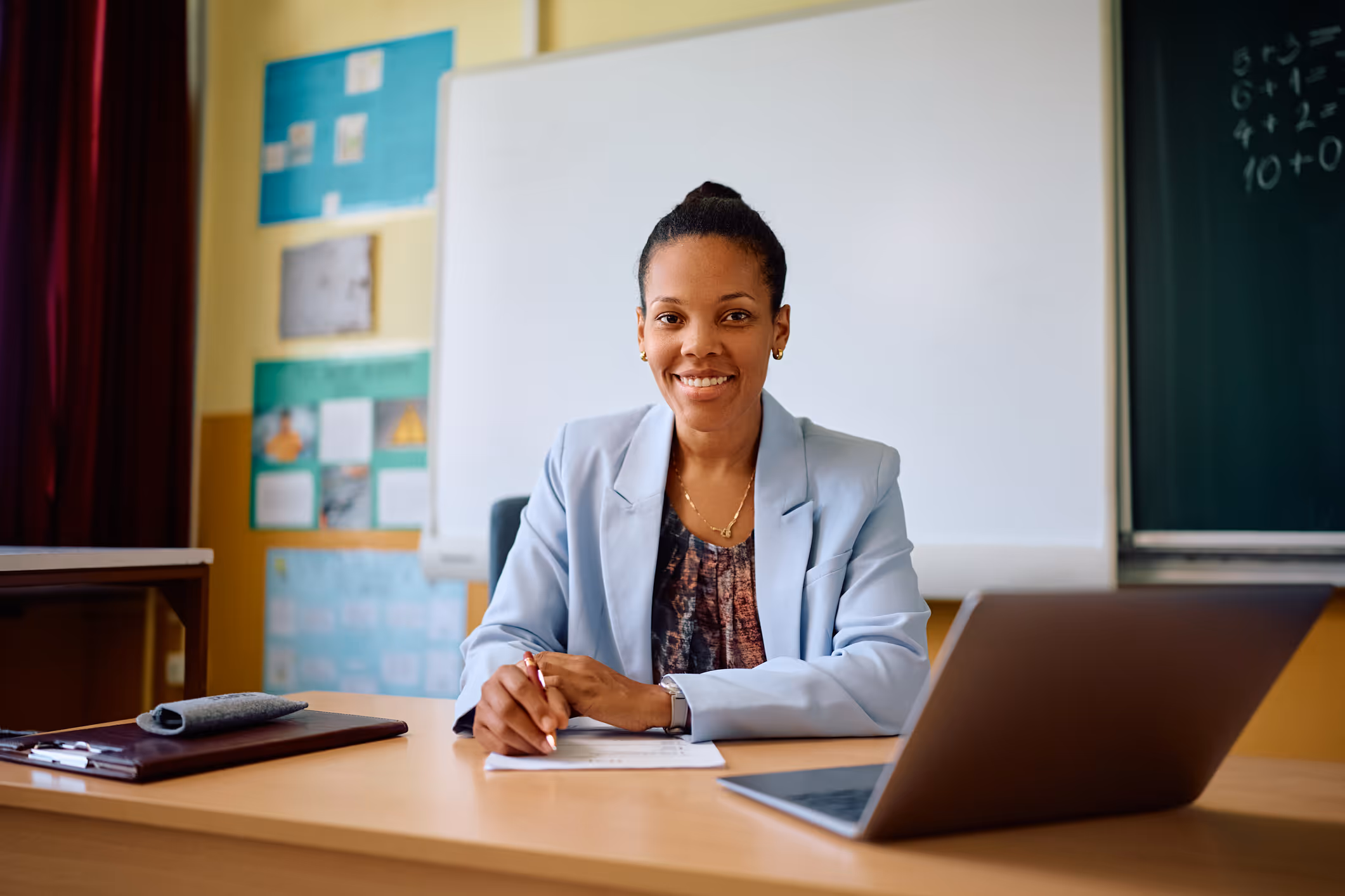 A San Jose school district administrator sits at her desk with a laptop during an initial educational staffing consultation.