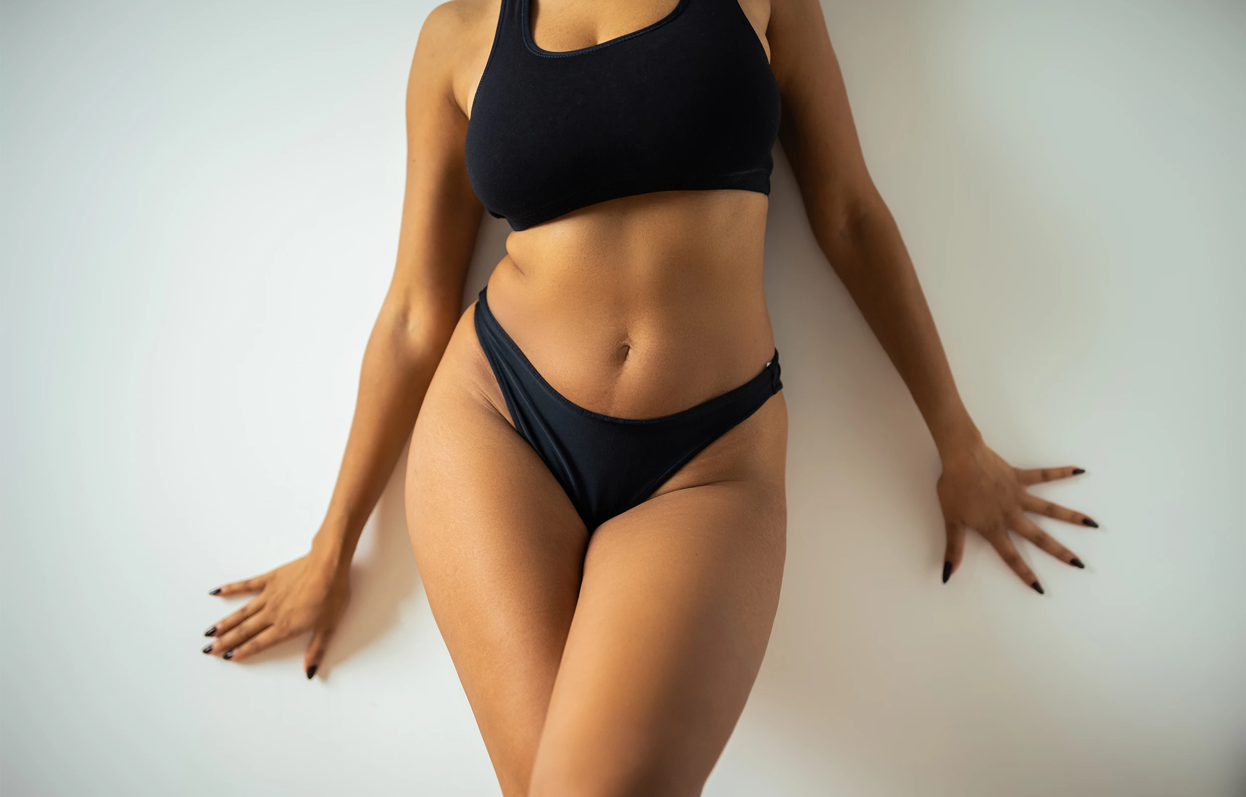 A woman showing her weight loss