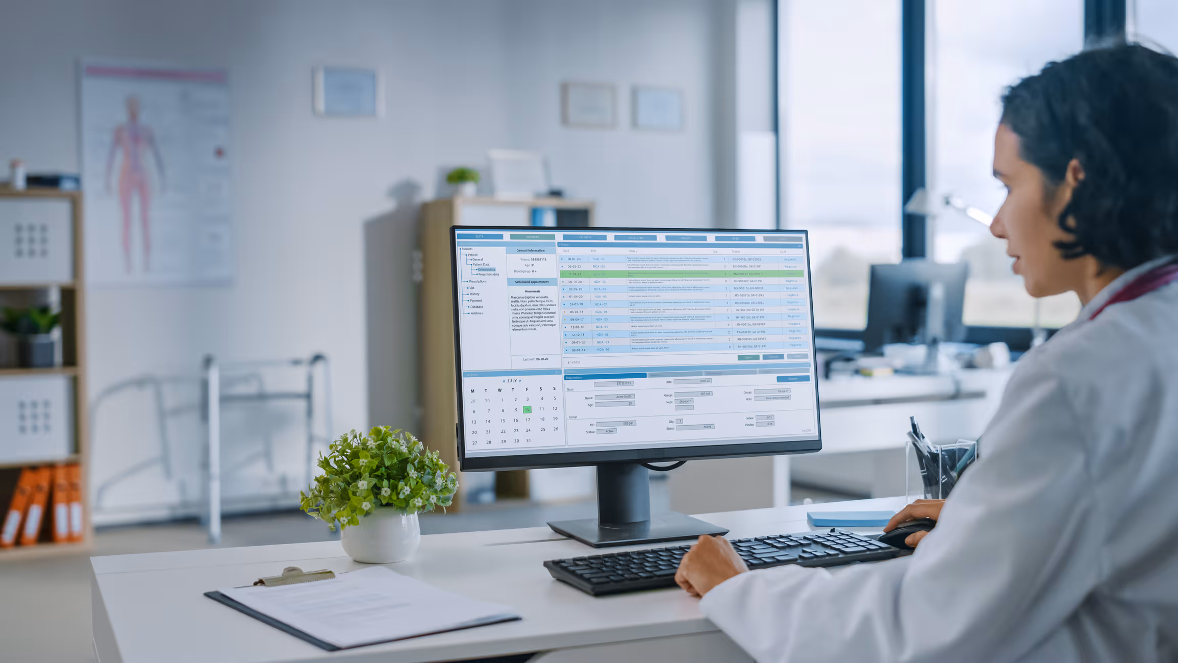 Over a doctor’s shoulder we see a spreadsheet of medical data on a vulnerable hospital computer.