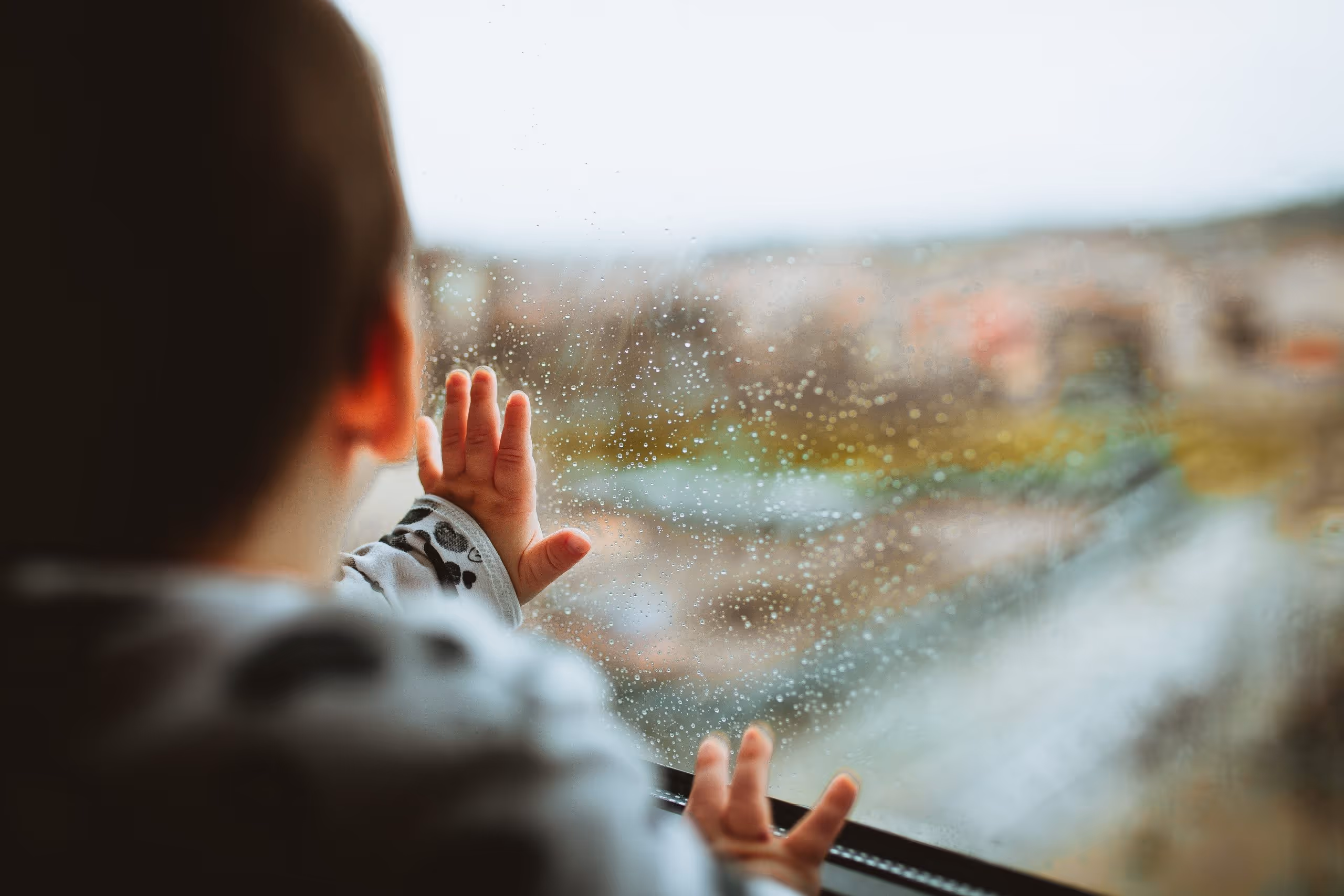 a child looking out a window