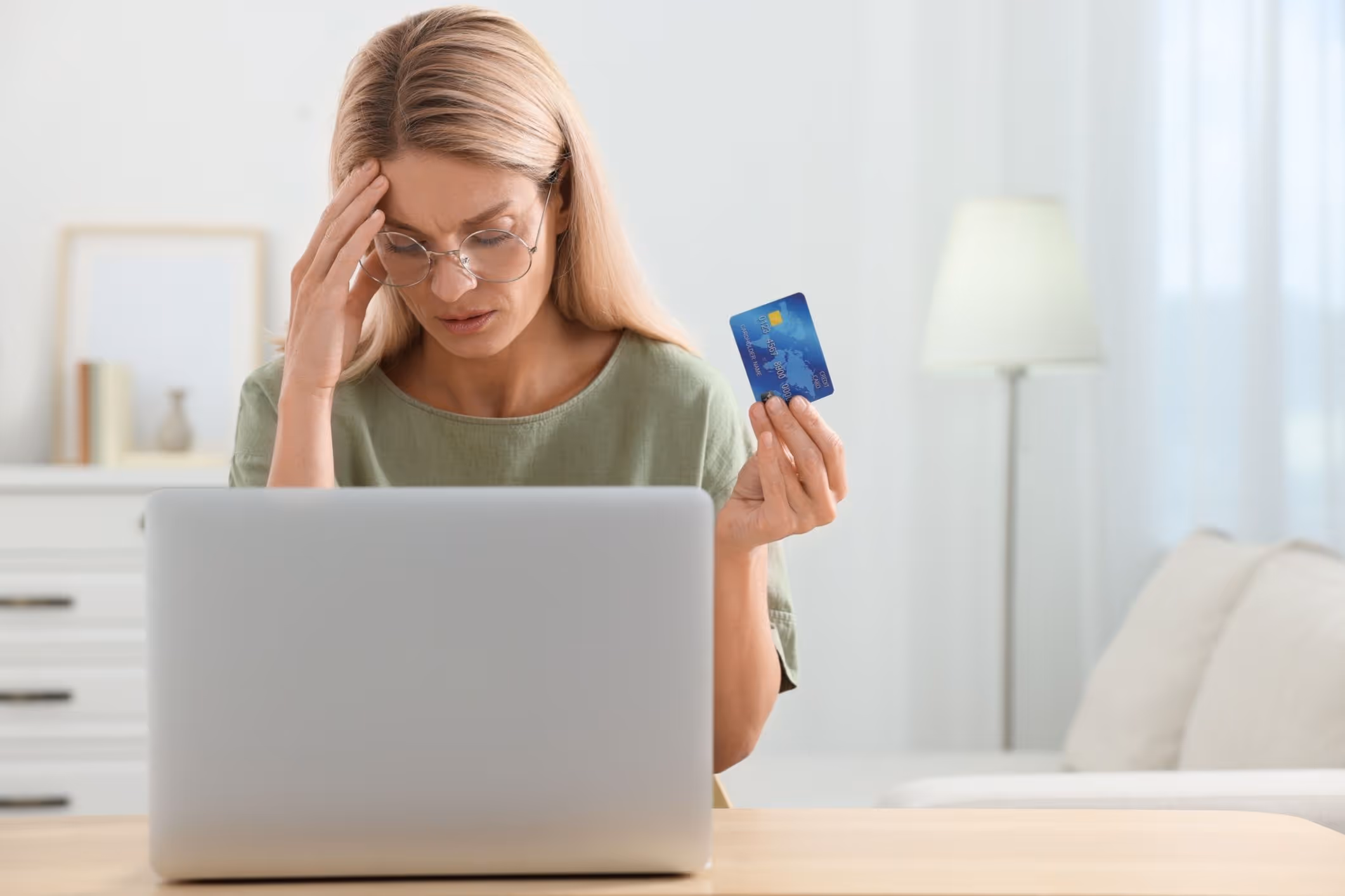 A woman discovers fraudulent credit card activity, realizing she may be a victim of tax refund fraud.