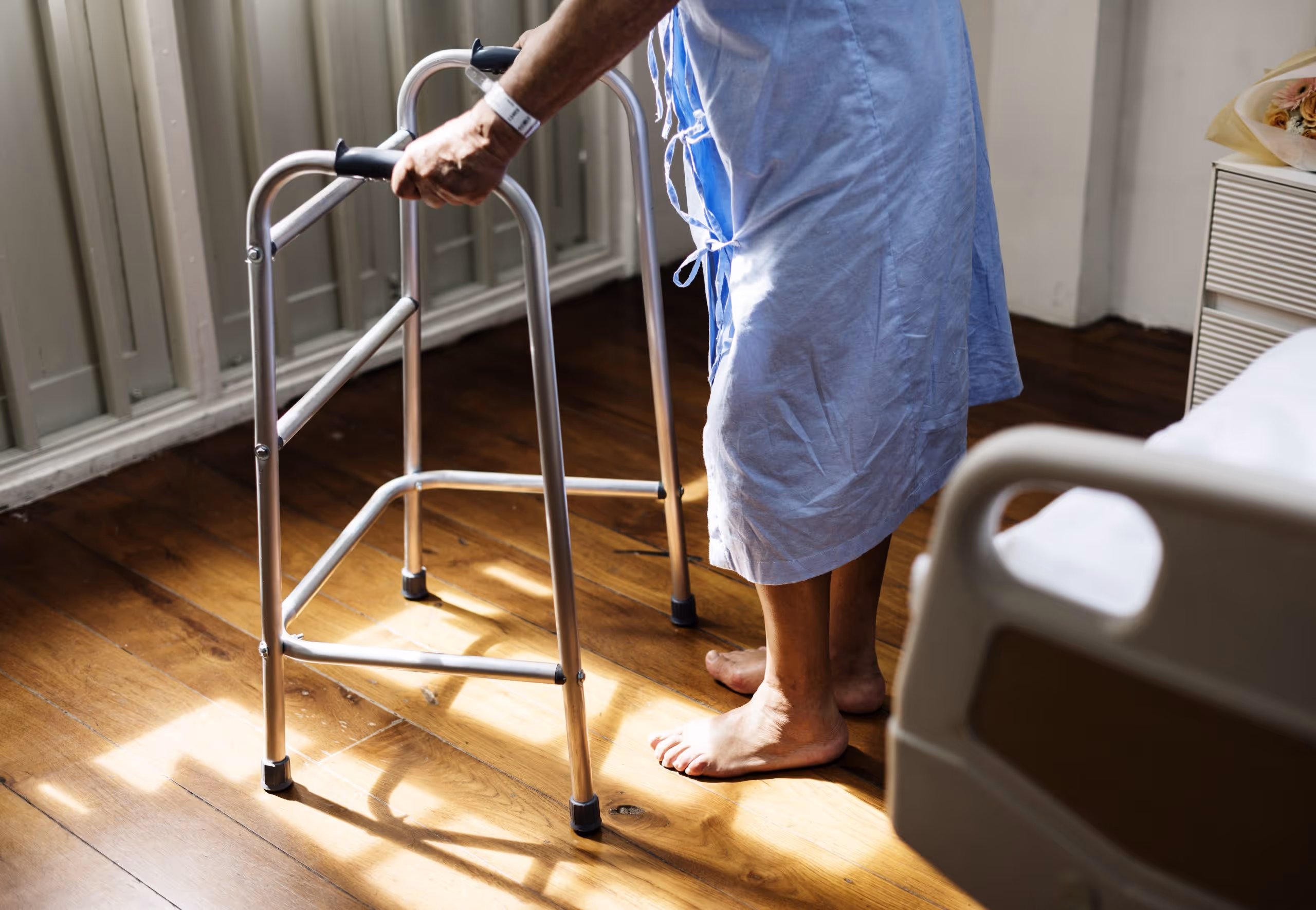 a nursing home patient using a walker