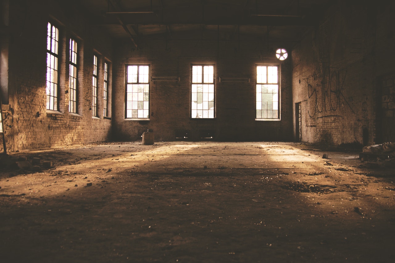An old abandoned,empty factory floor