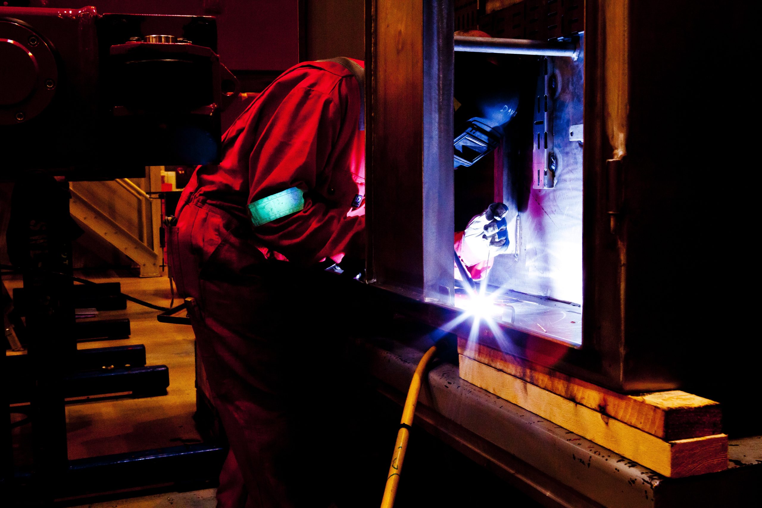 a man welding in a factory