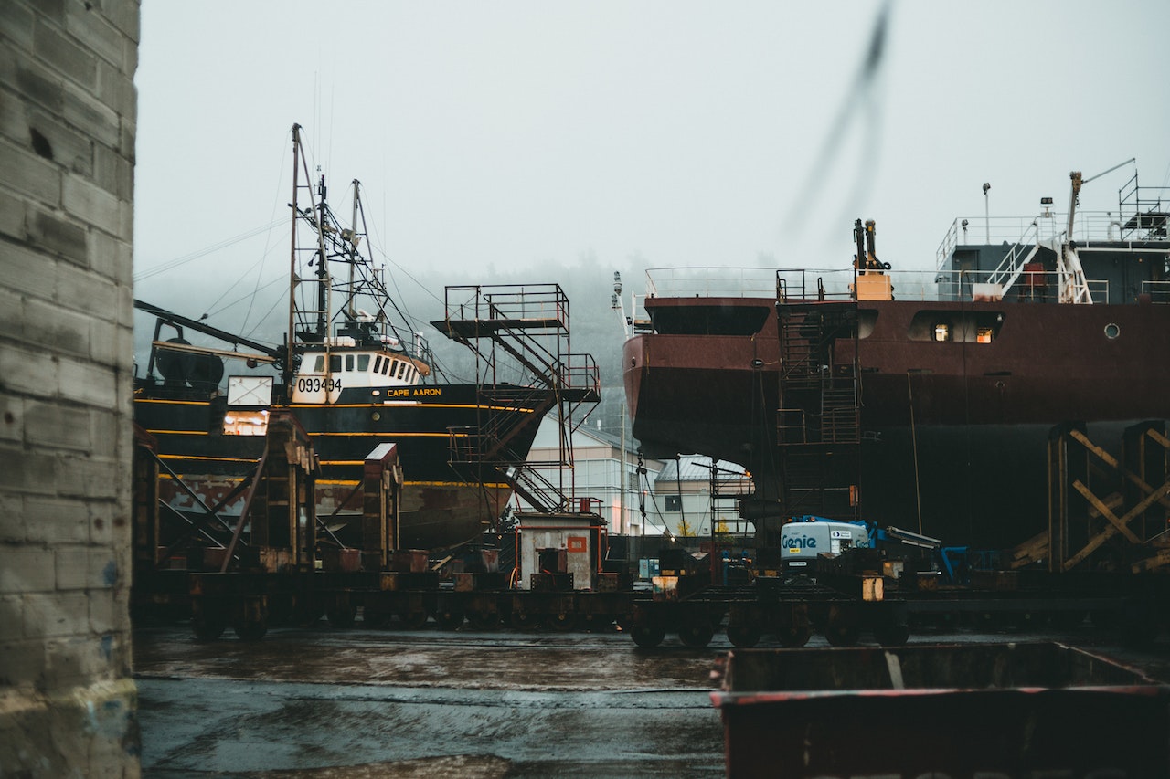 A shipyard with large boats docked