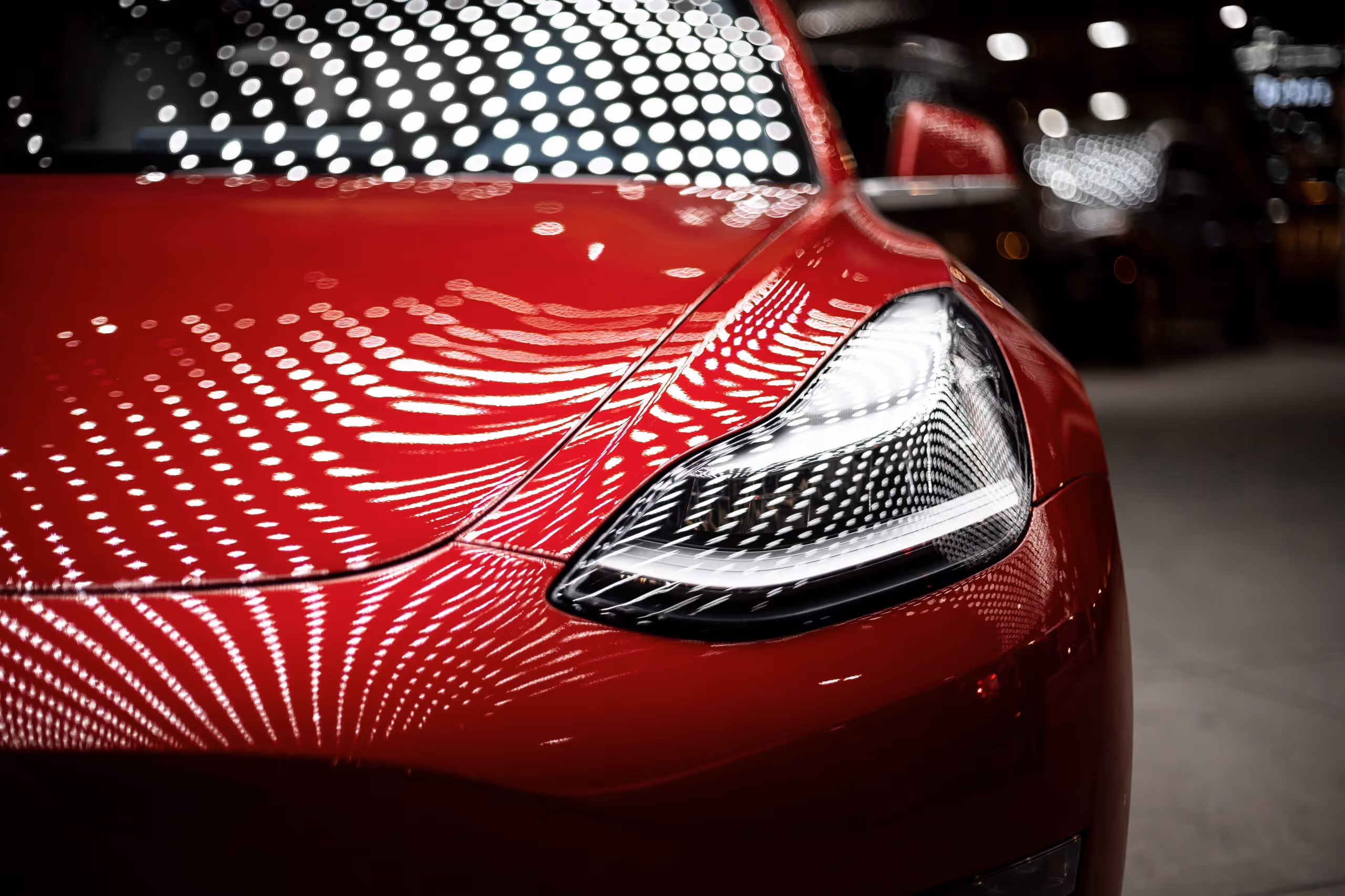 Red Tesla in a showroom