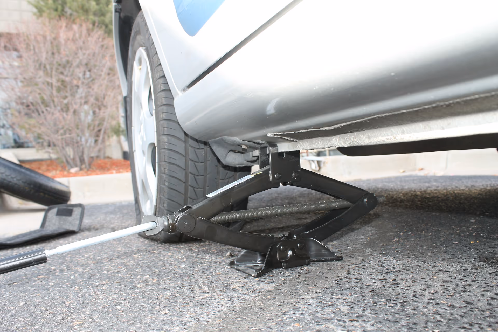 car jack with flat tire