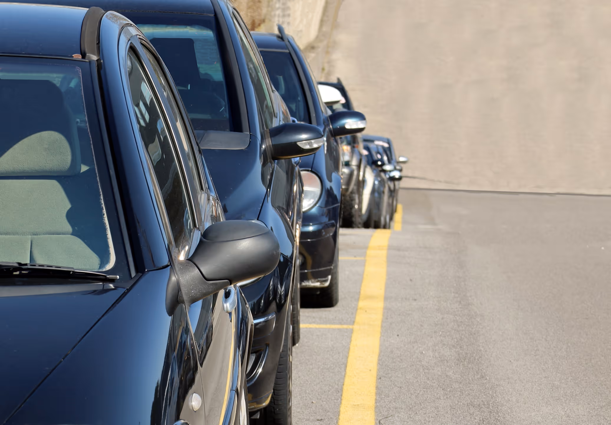 Rows of cars parked on a hill