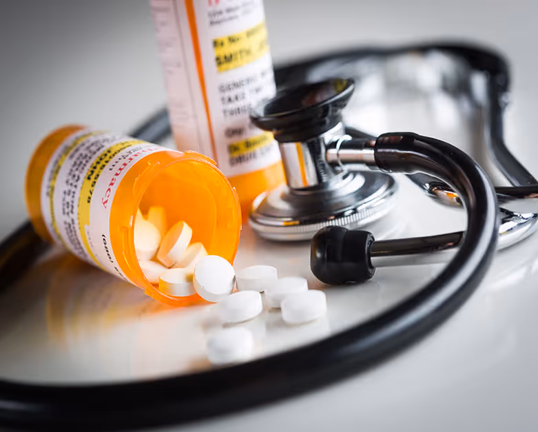 A stethoscope and pill bottles