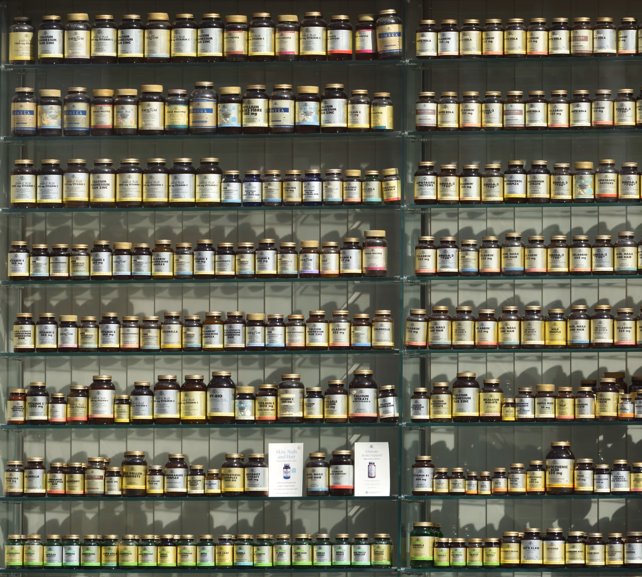 A shelf full of bottled supplements